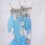 bebe blue feather and coin earrings