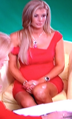 Alexis Bellino Red Off The Shoulder Dress While Talking to Video Coach Jackie O Black Halo