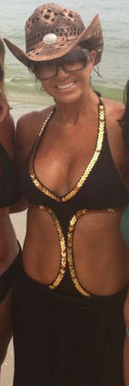Teresa Giudice Black and Gold Monokini at the beach on Twitter