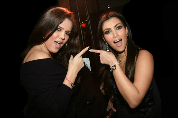 Kim & Khloe Kardashian wearing i.d x-change Cuffs of Love