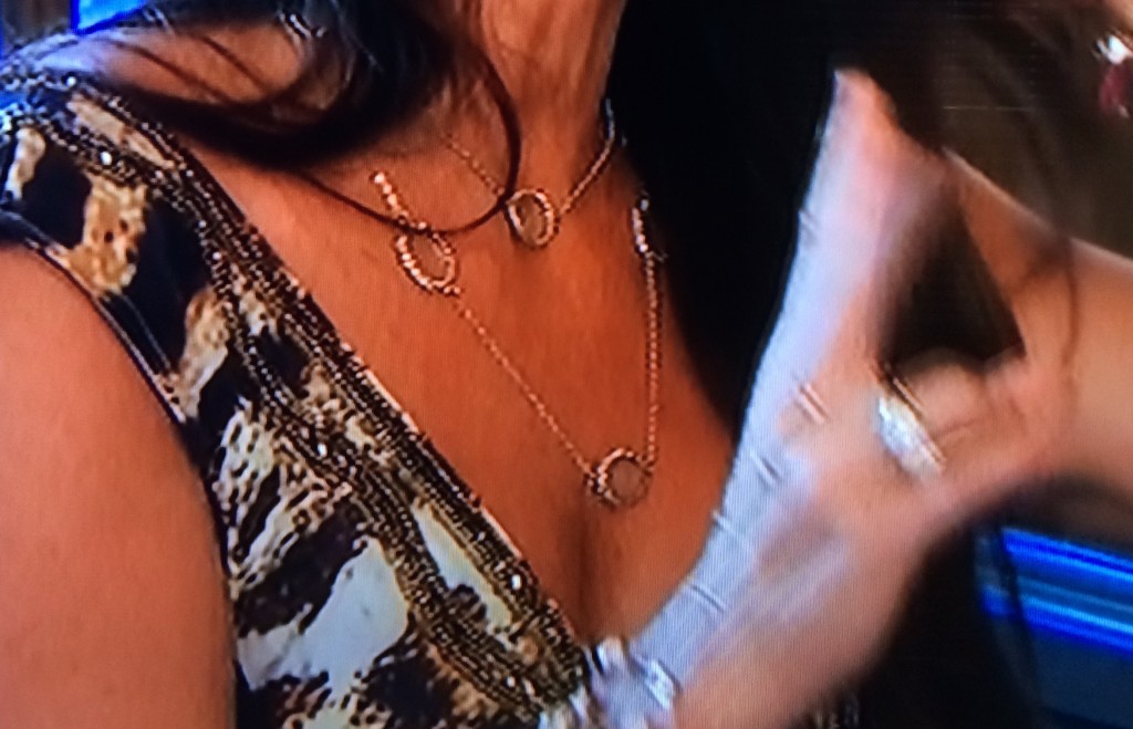 Kyle Richards wearing a Roni Blanshay station long crystal necklace