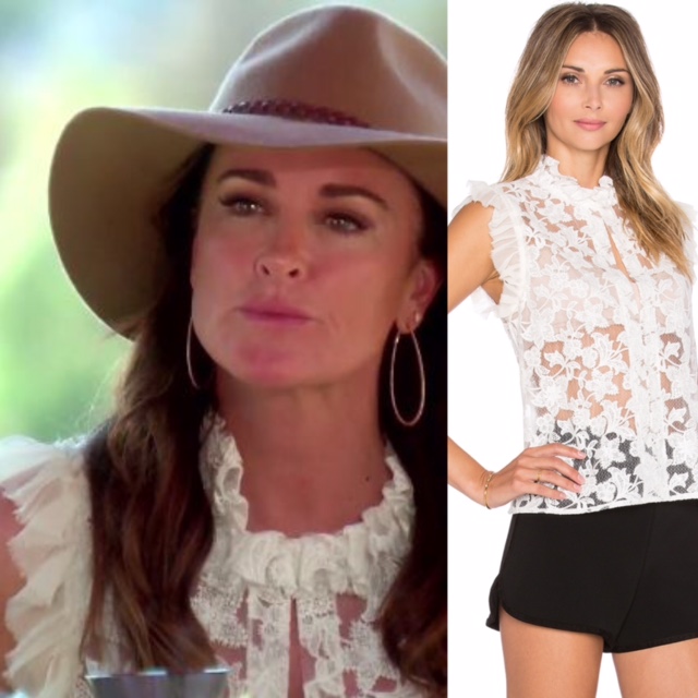Kyle Richards' White Lace Sleeveless Top with Tulle Sleeves