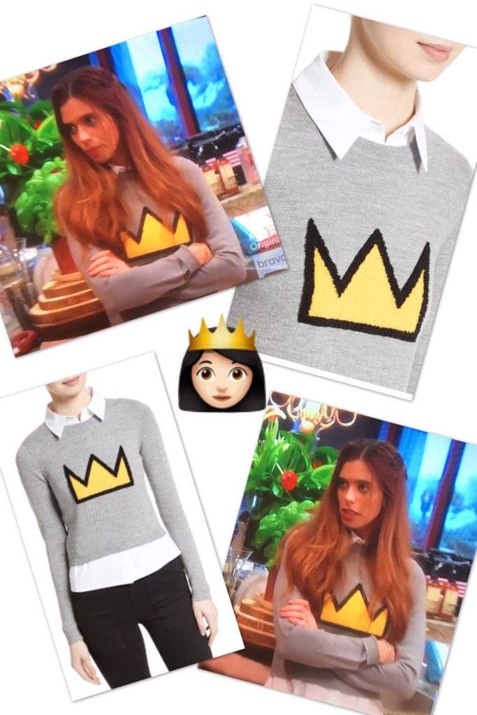 Lydia McLaughlin wearing a grey sweater with a yellow crown 