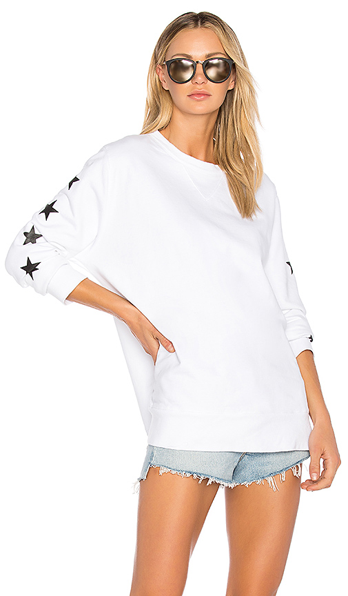 Melissa Gorga wearing a white Monrow sweatshirt with blue stars