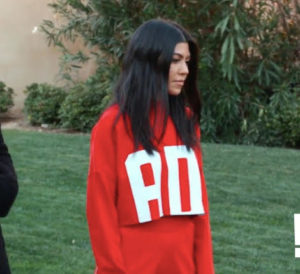 Kourtney Kardashian's Red Cropped Sweatshirt Outside with Khloe and Kim