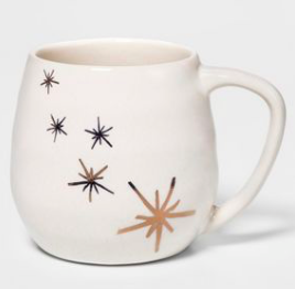 Chrissy Teigen's White Mug With Gold Stars Making Hot Cocoa