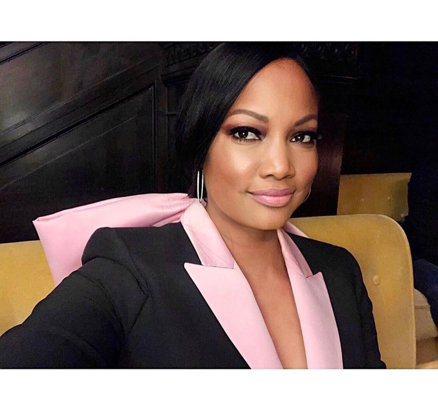 Garcelle Beauvais' Black and Pink Bow Blazer