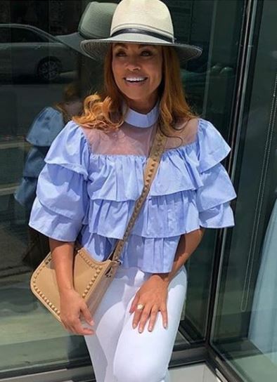 Gizelle Bryant's Sheer Blue Ruffle Top