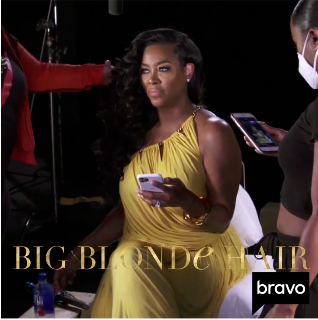 Kenya Moore's Yellow Chain Details Confessional Dress