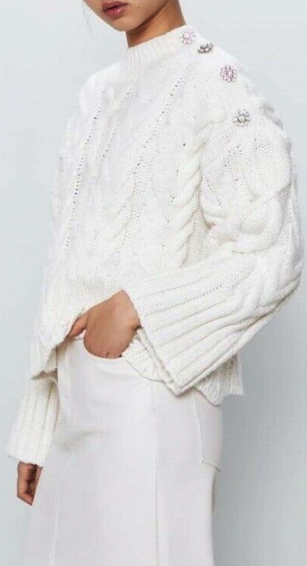 Ramona Singer’s White Crystal Button Sweater