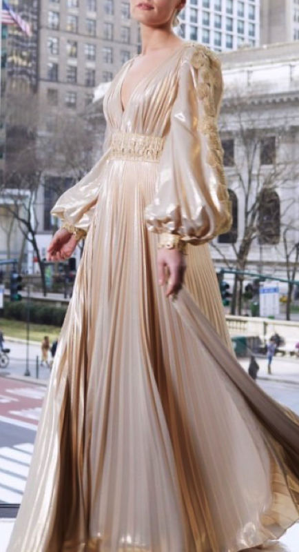 Kameron Westcott’s Gold Pleated Dress