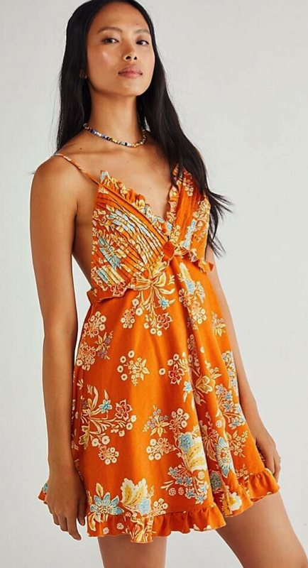 Dolores Catania’s Orange Floral Ruffle Dress