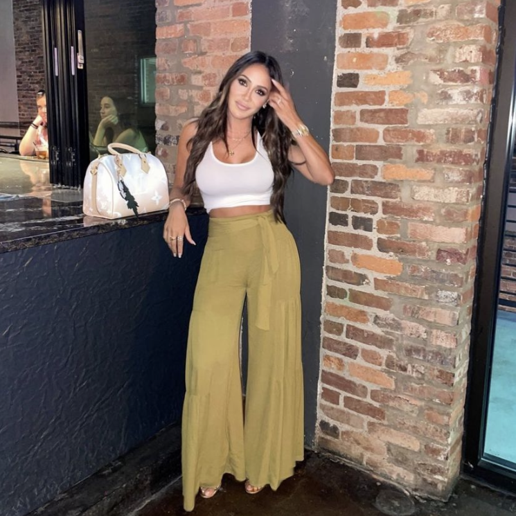 Melissa Gorga’s Mustard Tiered Pants and Ombre Louis Vuitton Bag