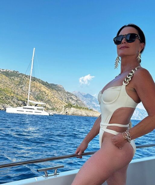 Kyle Richards' Chain Strap Swimsuit and Netted Cover Up