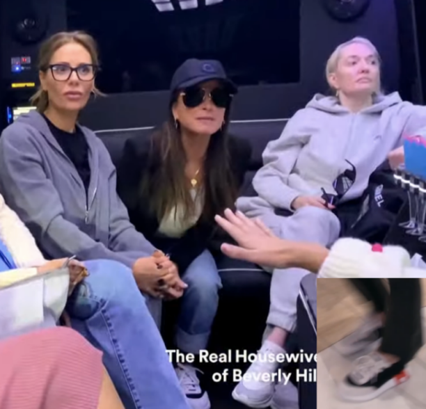 Kyle Richards' Black Sunglasses and Sneakers