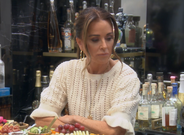 Kyle Richards' Ivory Knit Peplum Top