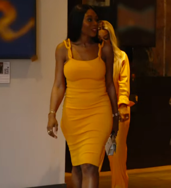 Nneka Ihim's Orange Chain Strap Dress