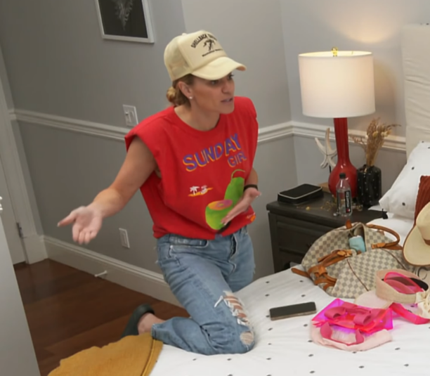 Lindsay Hubbard's Red Padded Shoulder Graphic Top