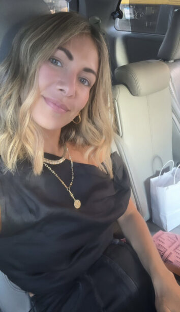 Erin Lichy's Black Satin Asymmetric Top